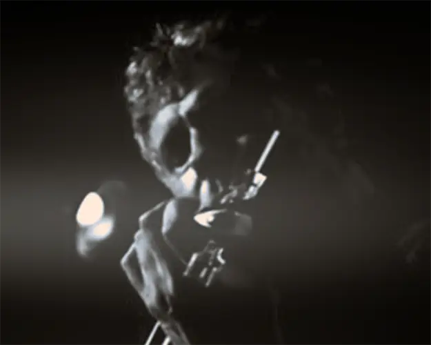 Close view of Mark Zaki performing violin under stage lighting