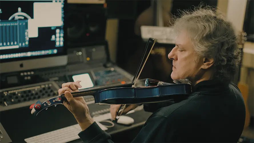 Mark Zaki playing electric violin in the studio