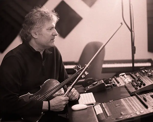 Mark Zaki with violin and electronic equipment in a studio session