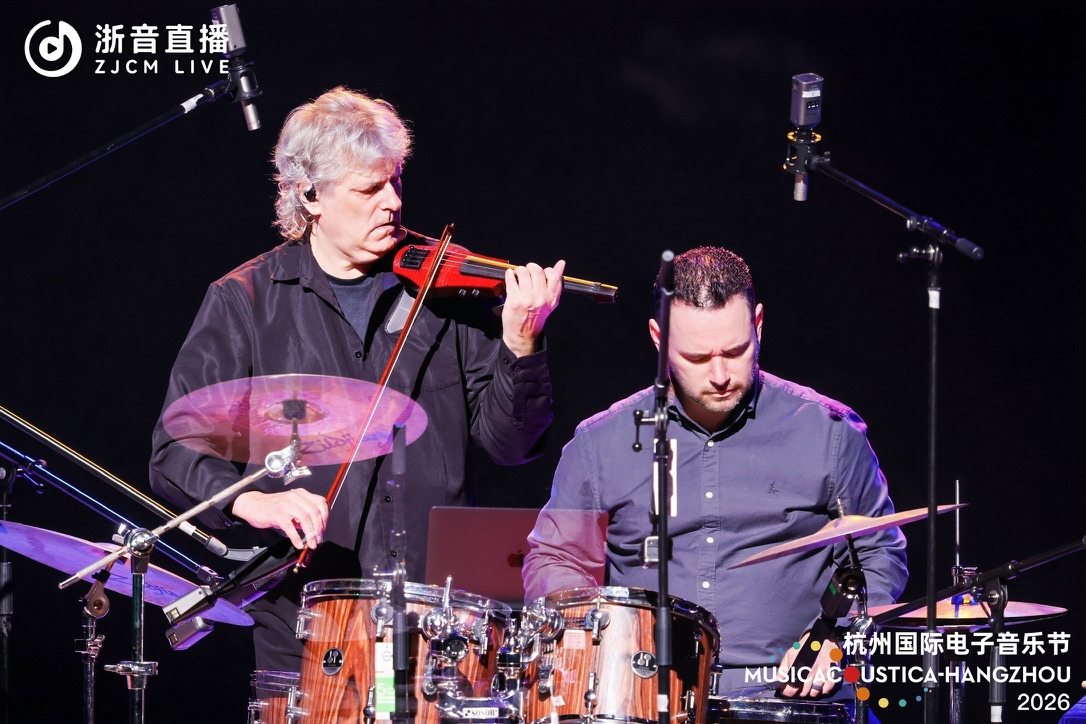 Mark Zaki performing with a percussionist at Musicacoustica-Hangzhou