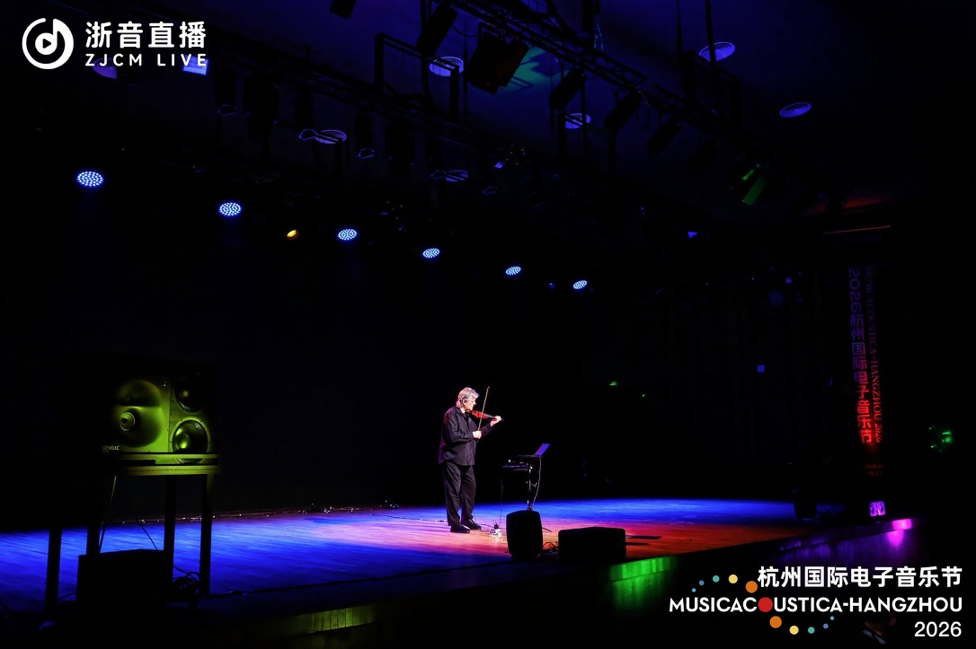 Mark Zaki performing violin and live electronics onstage at Musicacoustica-Hangzhou