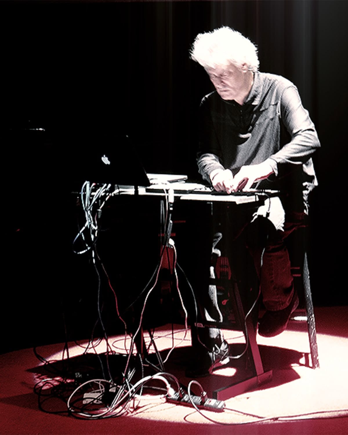 Mark Zaki performing with live electronic equipment onstage