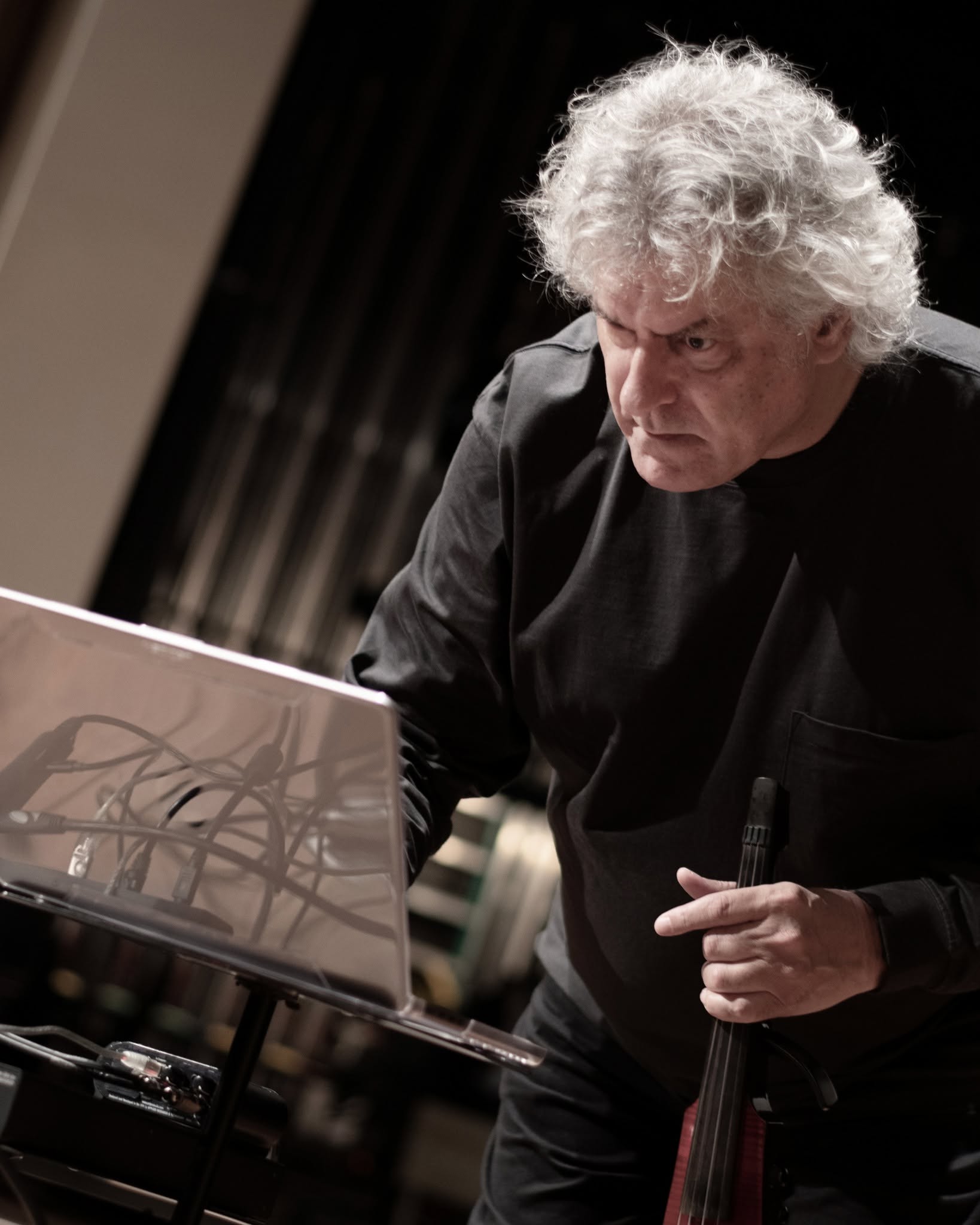 Close view of Mark Zaki working with electronic equipment during a performance