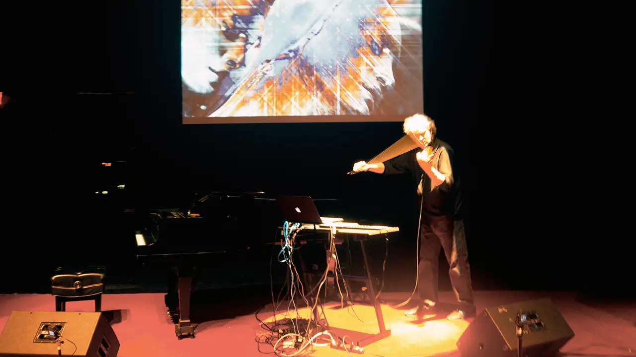 Mark Zaki performing violin and electronics with projected video