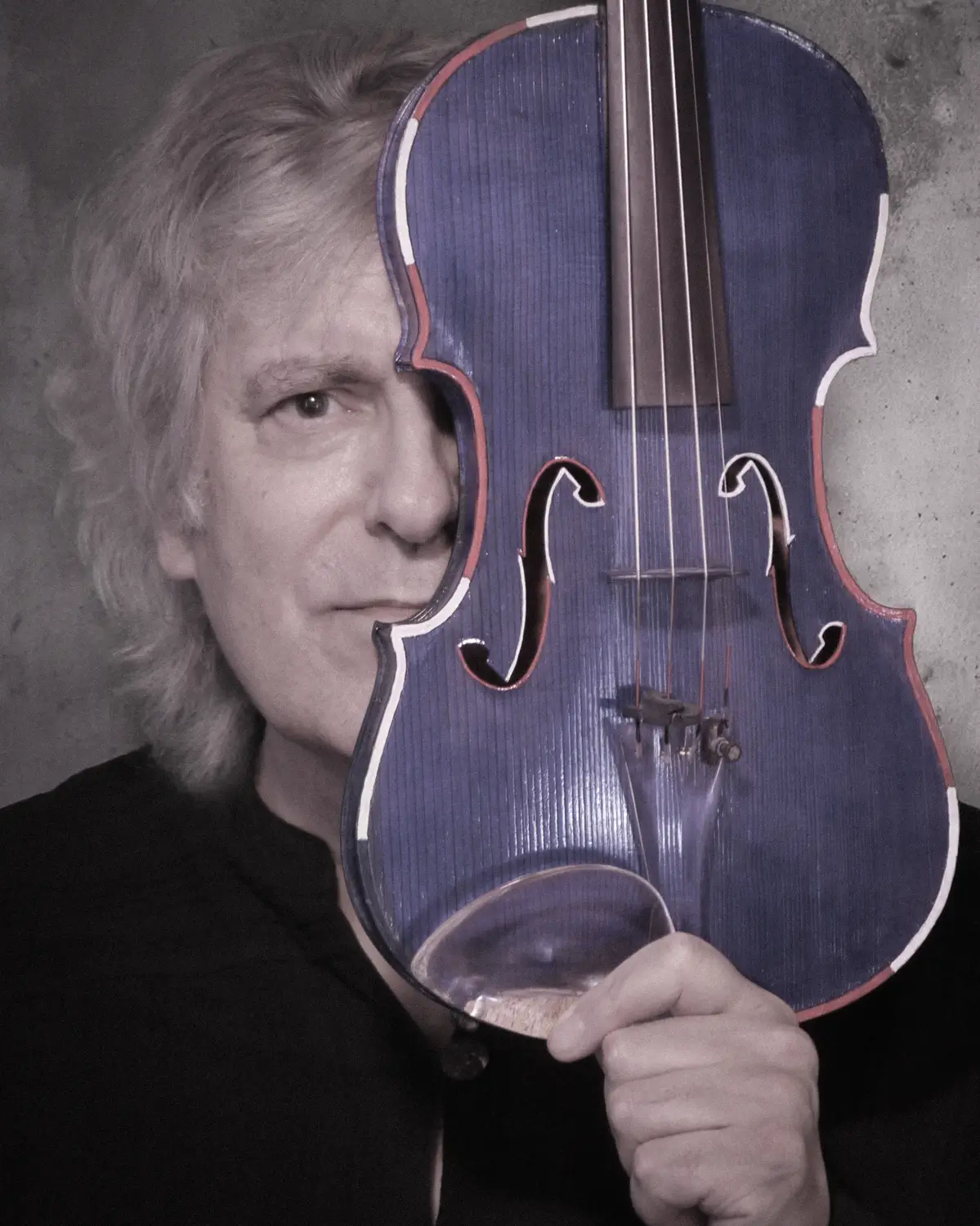 Mark Zaki with a blue violin